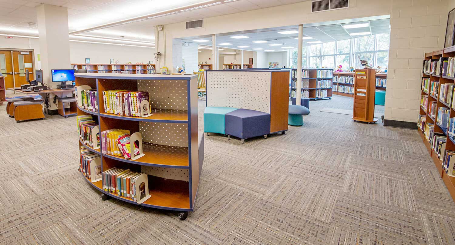 Elementary curved library bookshelves for organized storage and child-friendly reading spaces