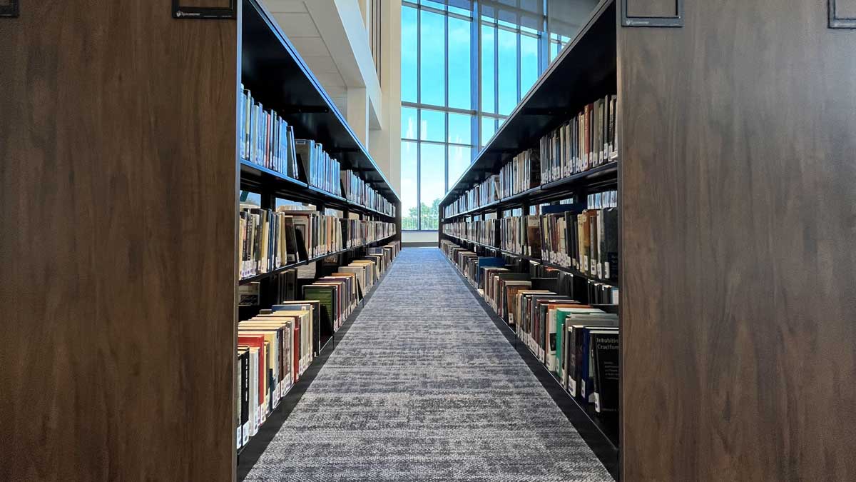 University library shelving rows with tall shelves for organized book storage
