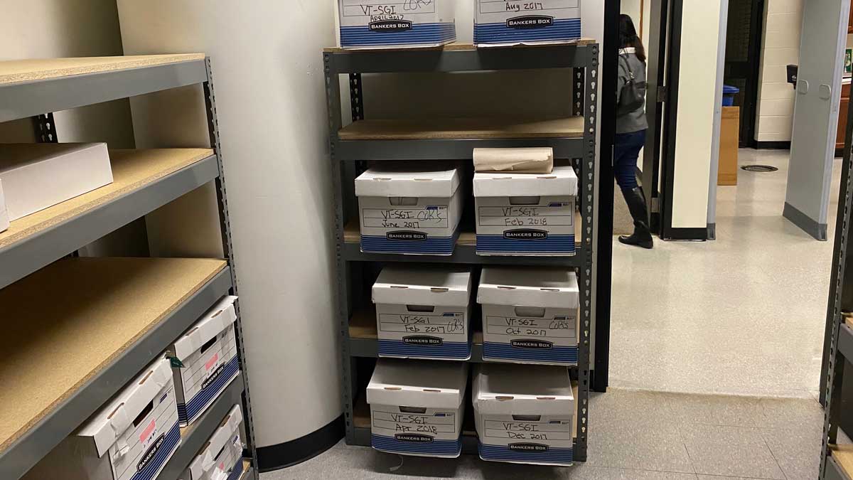 compact shelving system for managing storage boxes in tight spaces
