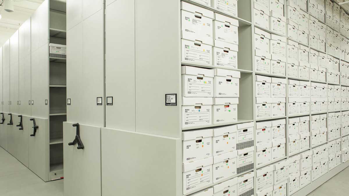 space-saving mechanical assist shelving holding police evidence boxes