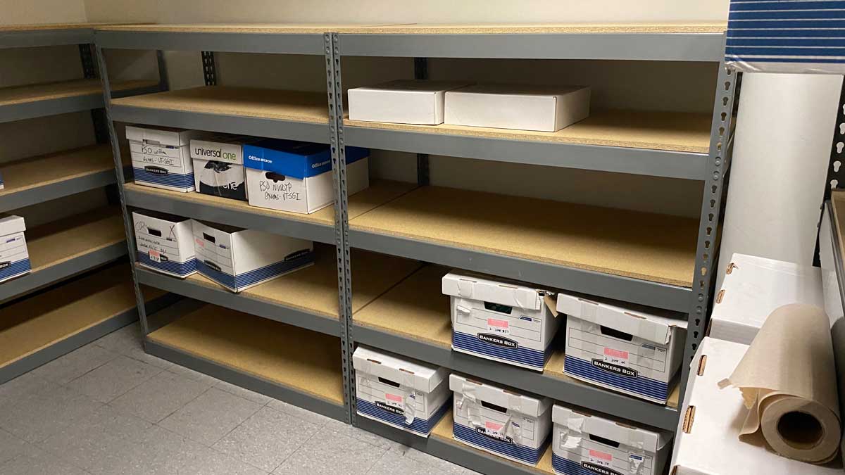 metal shelving system with multiple archival boxes for document storage