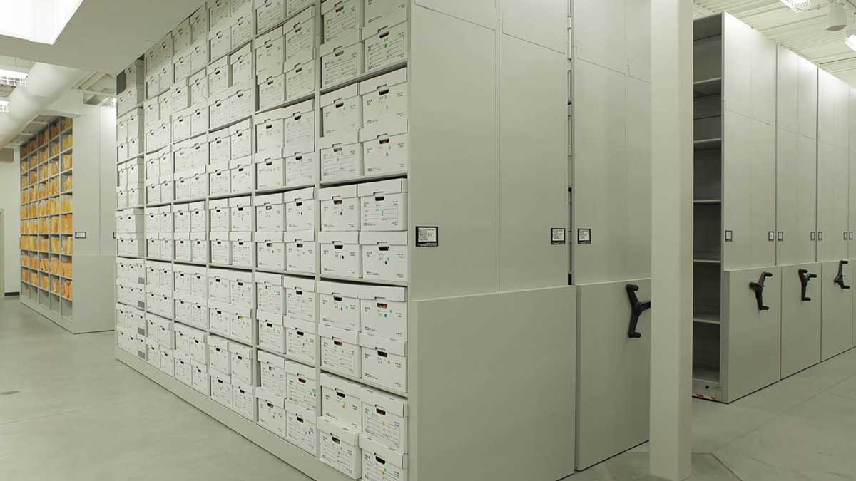 Evidence and records in labeled boxes on mobile shelving