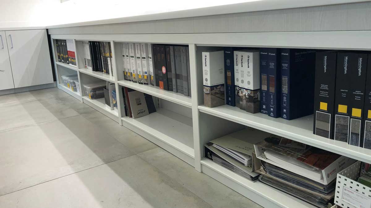 counter-height office shelving unit for easy access to documents and books