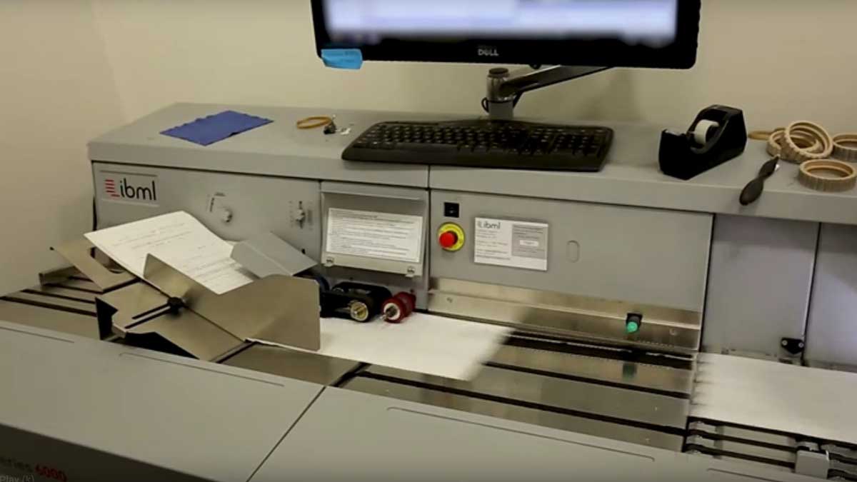 high-speed scanner processing multiple documents for digital conversion and secure storage
