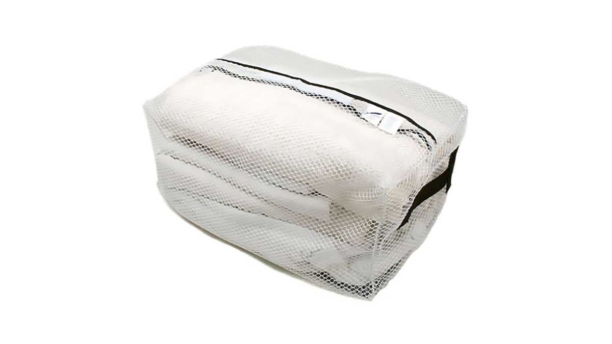 white mesh bag with zipper top ideal for storing and organizing clean folded garments in laundry operations