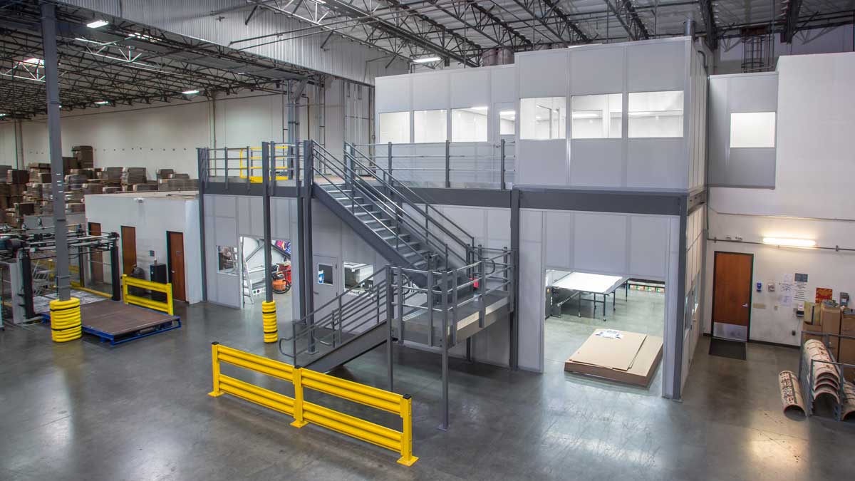 modular office mezzanine structure providing workspace above and access below for inventory or equipment