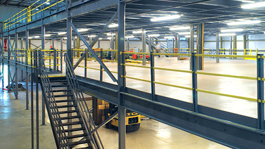 clear span mezzanine platform with open flooring and stair access for additional warehouse workspace