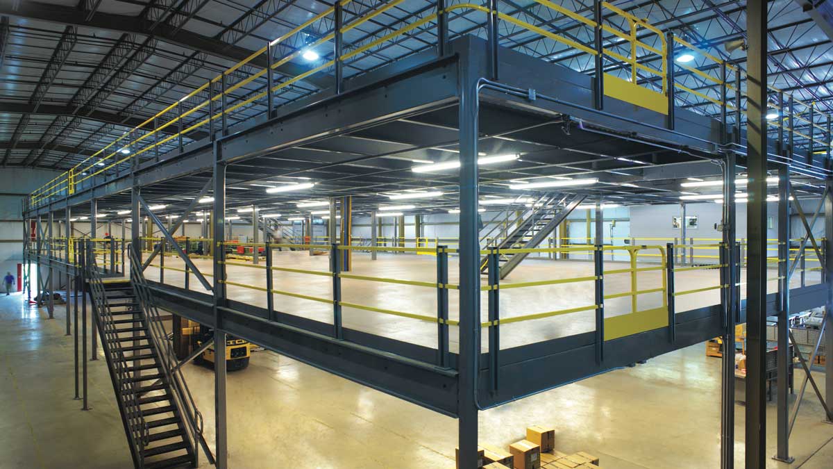 large open mezzanine structure with double staircases designed for increasing floor area in warehouse environments