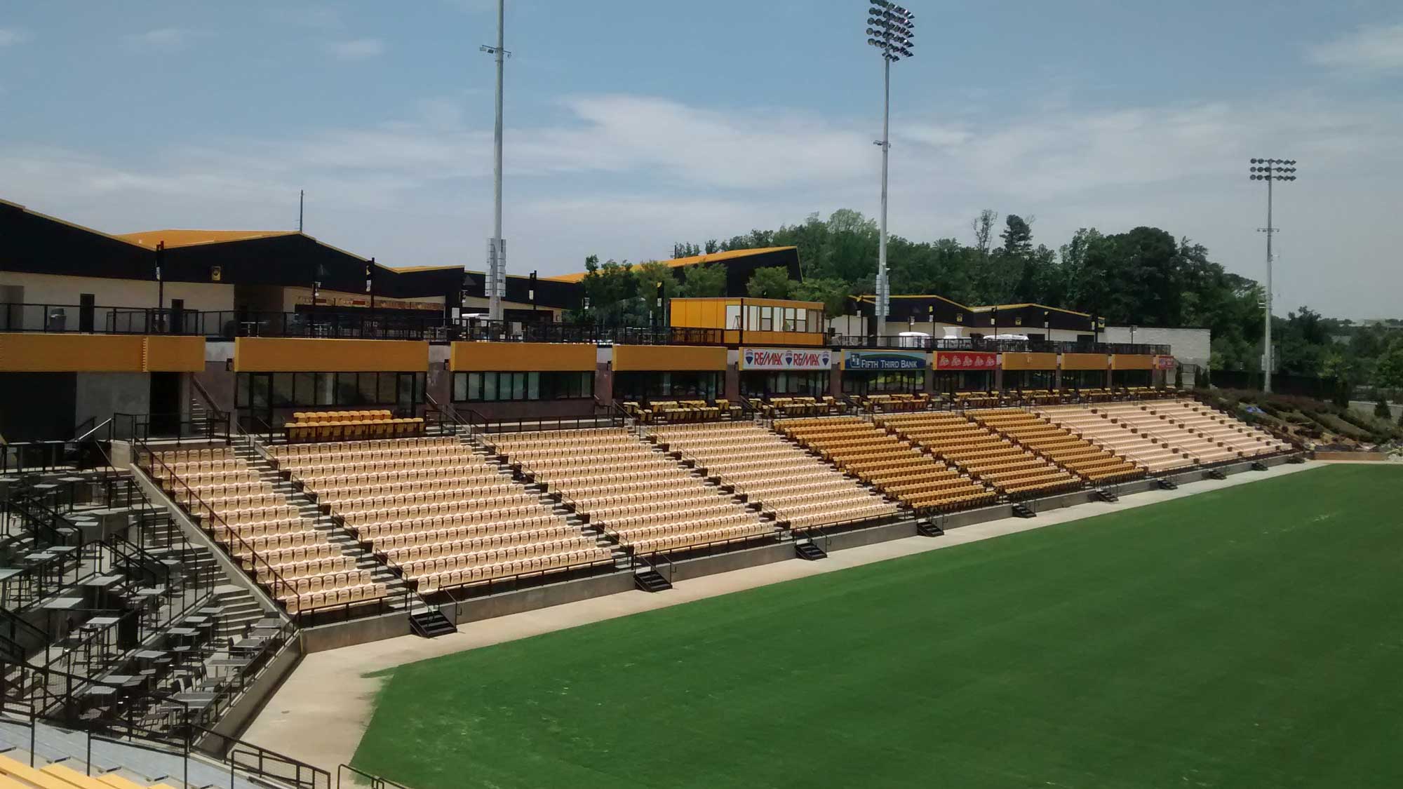 lineup of stadium press boxes installed above seating for game-day broadcasting