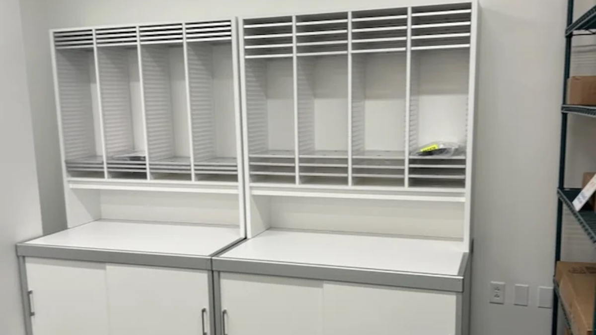 Modular storage casework station with open cubbies and work surfaces