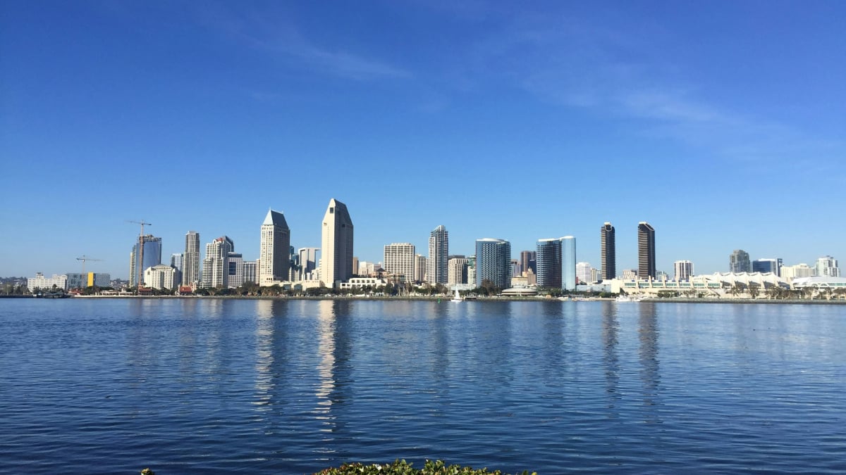 Waterfront skyline view San Diego with downtown buildings reflected across the bay