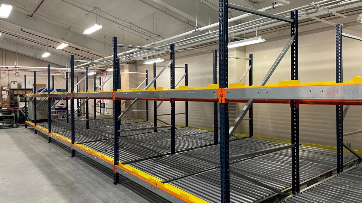 Warehouse flow rack storage with roller shelving for organized inventory movement