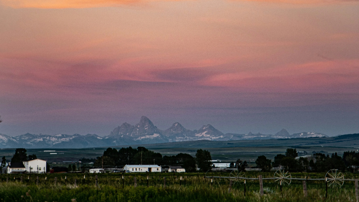 Mountain view landscape Idaho Falls with rural foreground and distant peaks