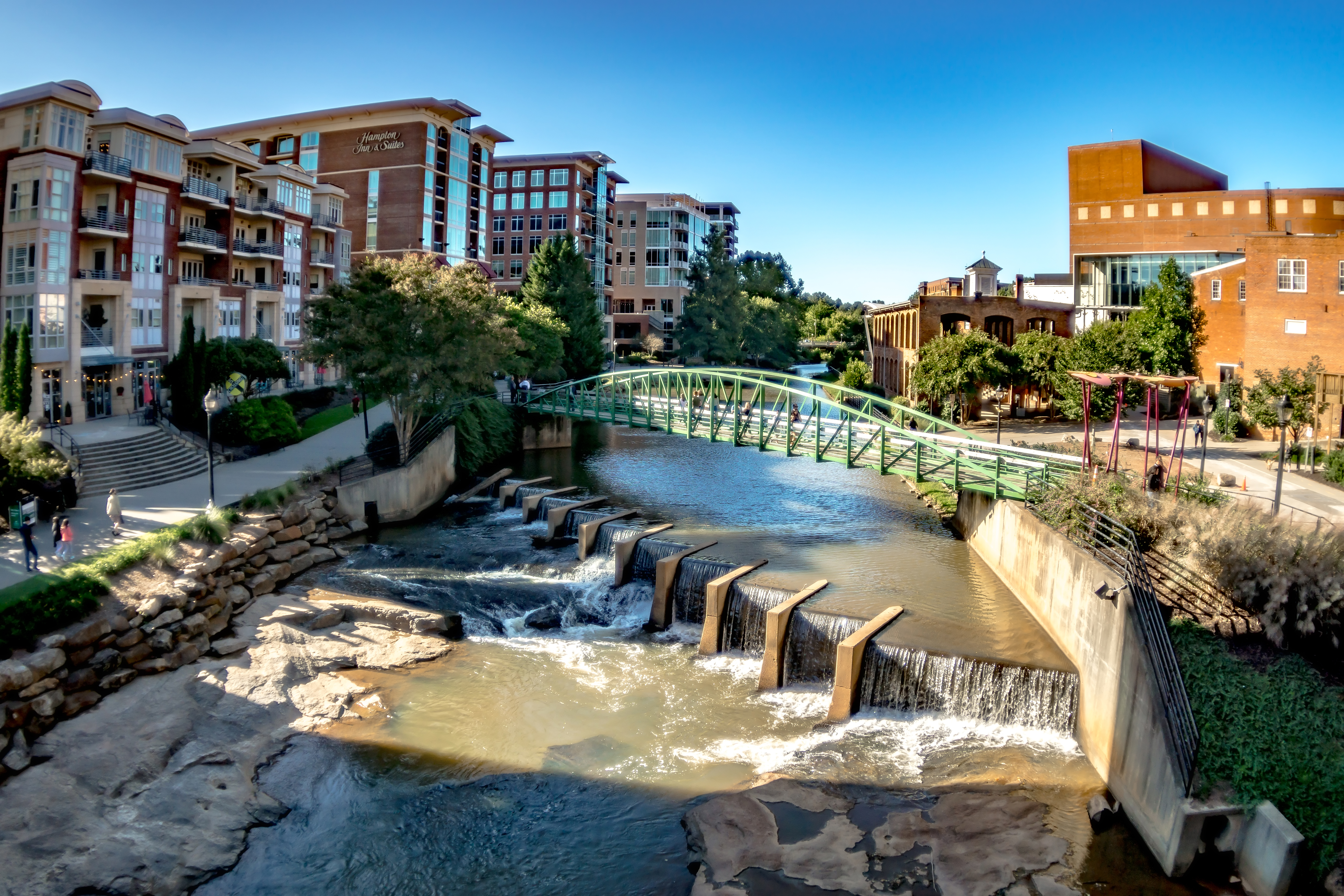 Greenville waterway with a bridge commecting downtown