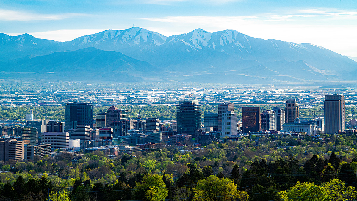 Salt Lake City, Utah downtown skyline with mountains behind the city